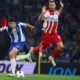 Porto's Dominik Prpic runs with the ball past Red Star's Marko Arnautovic, right, during the Europa League opening phase soccer match between FC Porto and Red Star Belgrade at the Dragao stadium in Porto, Portugal, Thursday, Oct. 2, 2025. (AP Photo/Luis Vieira)