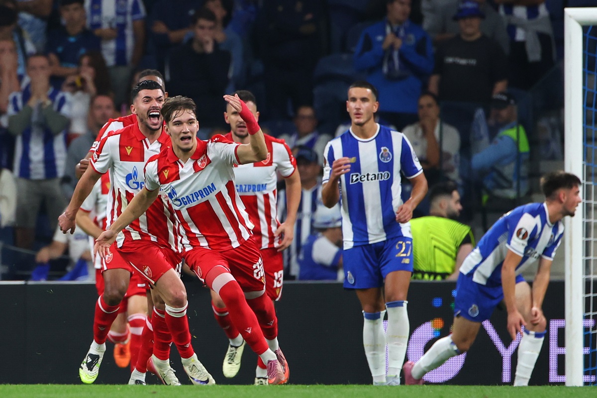 Red Star's Vasilije Kostov, foreground, celebrates after scoring his side's first goal during the Europa League opening phase soccer match between FC Porto and Red Star Belgrade at the Dragao stadium in Porto, Portugal, Thursday, Oct. 2, 2025. (AP Photo/Luis Vieira)