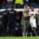 Real Madrid's Vinicius Junior is restrained by coaching staff duringa post match scuffle at La Liga soccer match between Real Madrid and Barcelona in Madrid, Spain, Sunday, Oct. 26, 2025. (AP Photo/Bernat Armangue)