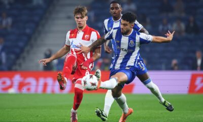 Red Star's Vasilije Kostov, left, vies for the ball with Porto's Angel Alarcon during the Europa League opening phase soccer match between FC Porto and Red Star Belgrade at the Dragao stadium in Porto, Portugal, Thursday, Oct. 2, 2025. (AP Photo/Luis Vieira)