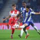 Red Star's Vasilije Kostov, left, vies for the ball with Porto's Angel Alarcon during the Europa League opening phase soccer match between FC Porto and Red Star Belgrade at the Dragao stadium in Porto, Portugal, Thursday, Oct. 2, 2025. (AP Photo/Luis Vieira)
