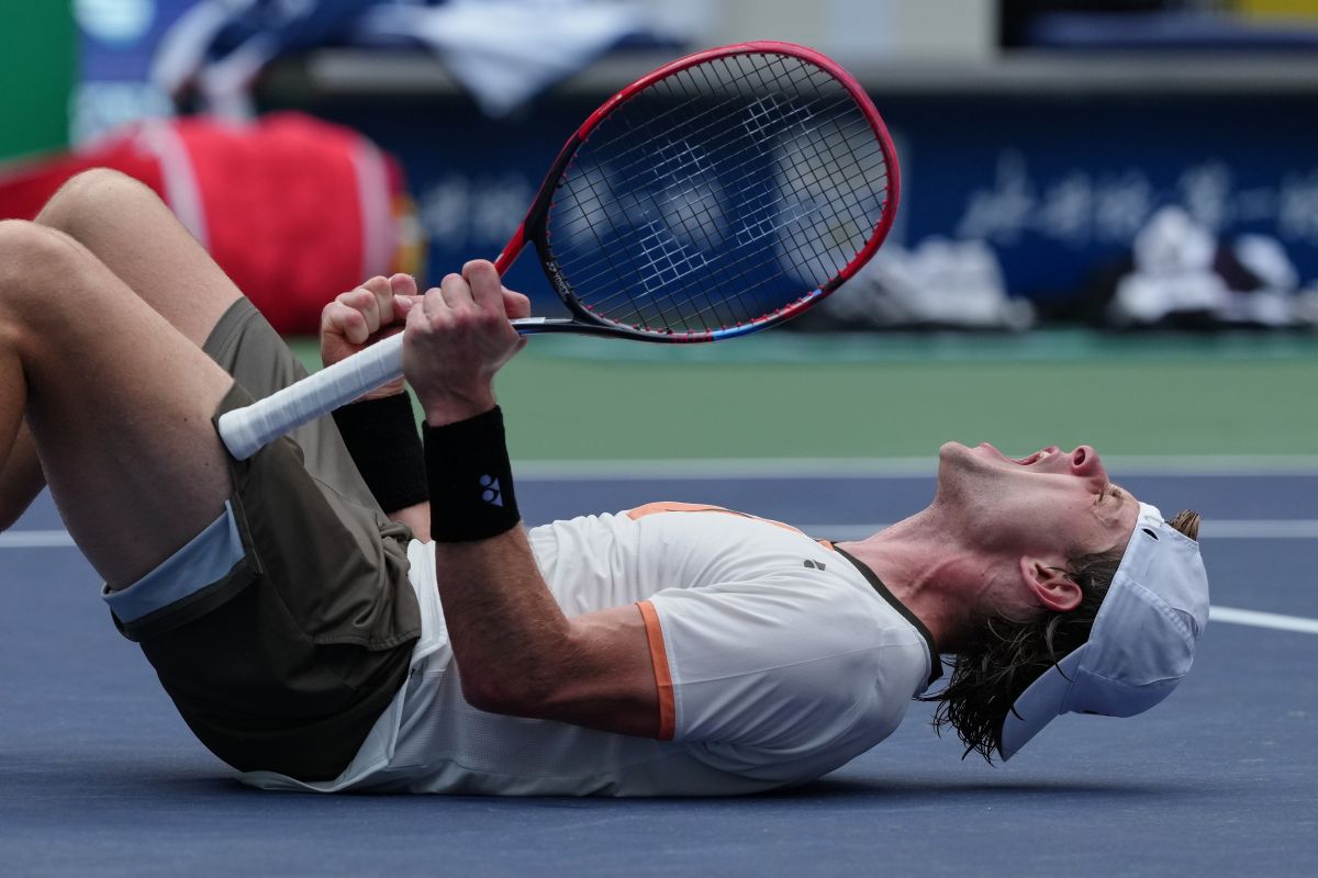 Zizou Bergs, of Belgium, reacts after defeating Gabriel Diallo, of Canada in the men's singles match of the Shanghai Masters tennis tournament at Qizhong Forest Sports City Tennis Center, in Shanghai, China, Tuesday, Oct. 7, 2025. (AP Photo/Andy Wong)