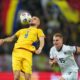Romania's Daniel Birligea controls the ball next to Austria's Philipp Lienhart during the World Cup 2026 group H qualifying soccer match between Romania and Austria at the National Arena stadium, in Bucharest, Romania, Sunday, Oct. 12, 2025. (AP Photo/Andreea Alexandru)