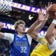 Dallas Mavericks forward Cooper Flagg (32) blocks a shot from Los Angeles Lakers center Jaxson Hayes (11) during the first half of a preseason NBA basketball game Wednesday, Oct. 15, 2025, in Las Vegas. (AP Photo/Ian Maule)