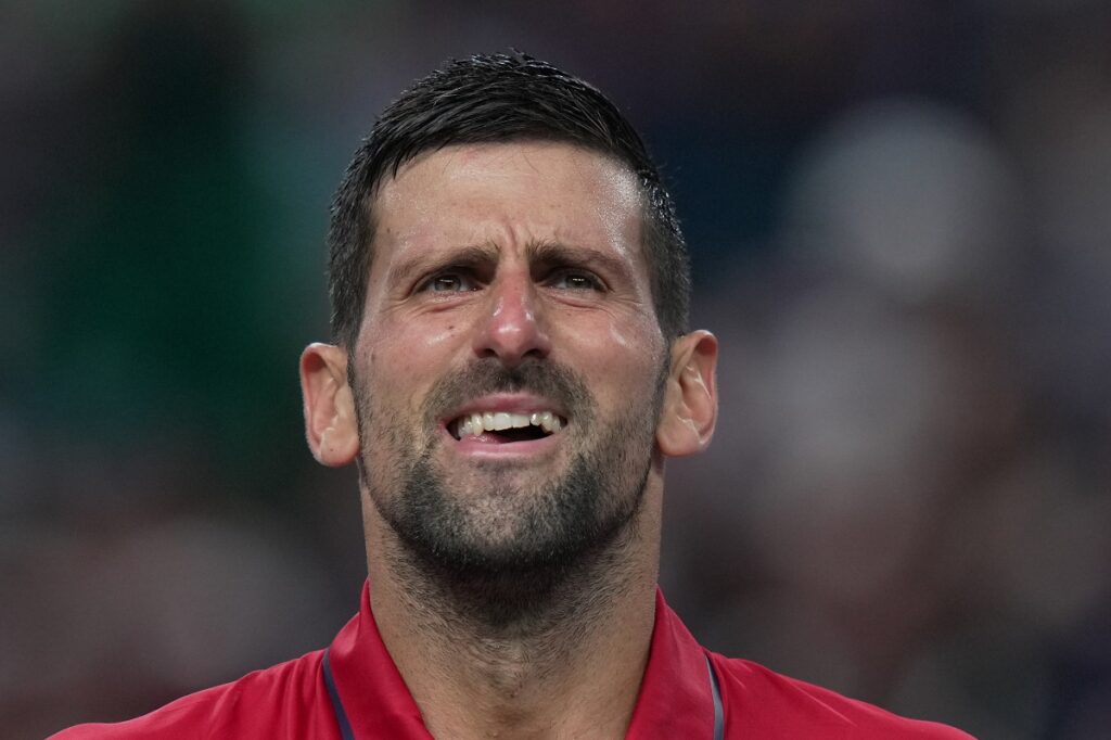 Novak Djokovic, of Serbia, reacts as he plays against Valentin Vacherot, of Monaco, during the men's singles semifinal match of the Shanghai Masters tennis tournament at Qizhong Forest Sports City Tennis Center, in Shanghai, China, Saturday, Oct. 11, 2025. (AP Photo/Andy Wong)