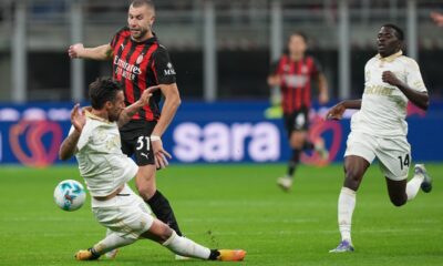 Pisa's Antonio Caracciolo tackles AC Milan's Strahinja Pavlovic during the Serie A soccer match between AC Milan and Pisa in Milan, Italy, Friday, Oct. 24, 2025. (AP Photo/Antonio Calanni)