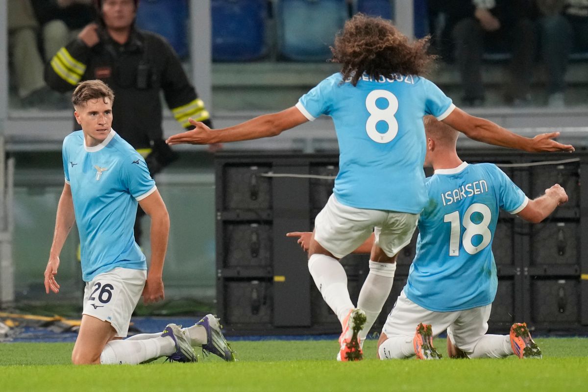 Lazio's Toma Basic, left, celebrates after scoring during the Italian Serie A soccer match between Lazio and Juventus in Rome, Sunday, Oct. 26, 2025. (AP Photo/Gregorio Borgia)