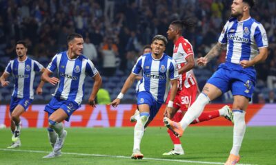 Porto's William Gomes, center, celebrates after scoring the opening goal from the penalty spot during the Europa League opening phase soccer match between FC Porto and Red Star Belgrade at the Dragao stadium in Porto, Portugal, Thursday, Oct. 2, 2025. (AP Photo/Luis Vieira)