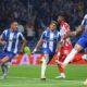 Porto's William Gomes, center, celebrates after scoring the opening goal from the penalty spot during the Europa League opening phase soccer match between FC Porto and Red Star Belgrade at the Dragao stadium in Porto, Portugal, Thursday, Oct. 2, 2025. (AP Photo/Luis Vieira)
