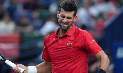Novak Djokovic, of Serbia, reacts as he plays against Valentin Vacherot, of Monaco, during the men's singles semifinal match of the Shanghai Masters tennis tournament at Qizhong Forest Sports City Tennis Center, in Shanghai, China, Saturday, Oct. 11, 2025. (AP Photo/Andy Wong)
