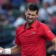 Novak Djokovic, of Serbia, reacts as he plays against Valentin Vacherot, of Monaco, during the men's singles semifinal match of the Shanghai Masters tennis tournament at Qizhong Forest Sports City Tennis Center, in Shanghai, China, Saturday, Oct. 11, 2025. (AP Photo/Andy Wong)
