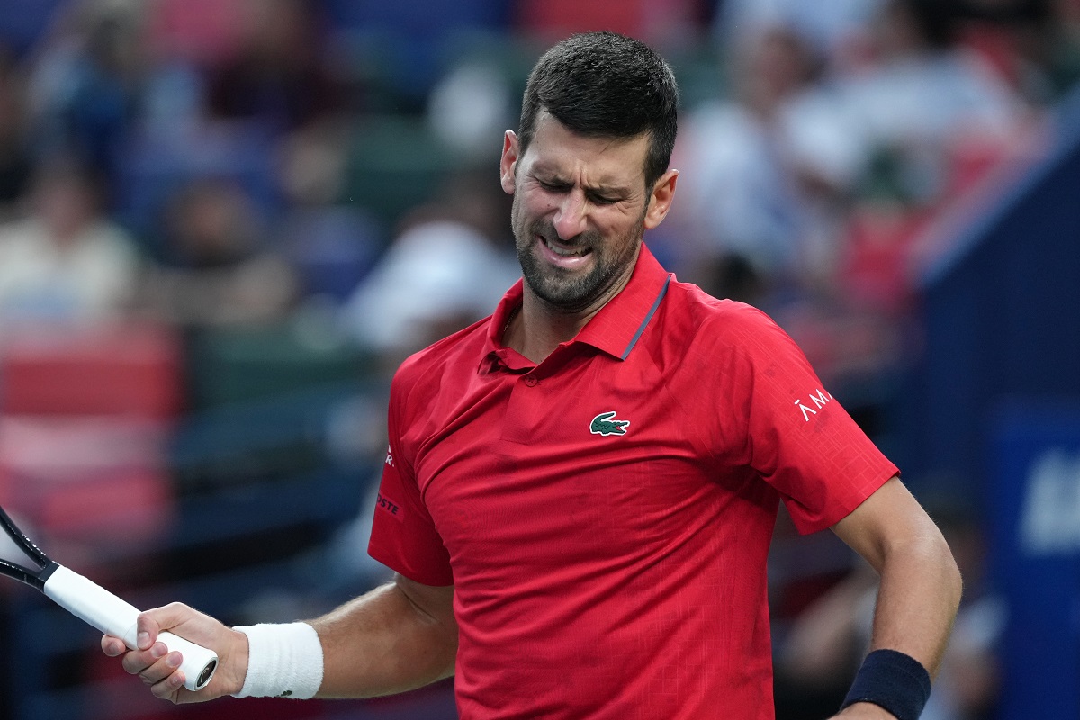 Novak Djokovic, of Serbia, reacts as he plays against Valentin Vacherot, of Monaco, during the men's singles semifinal match of the Shanghai Masters tennis tournament at Qizhong Forest Sports City Tennis Center, in Shanghai, China, Saturday, Oct. 11, 2025. (AP Photo/Andy Wong)