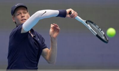 Jannik Sinner of Italy returns a shot to Learner Tien of the United States in the men's singles final match for the China Open tennis tournament in Beijing on Wednesday, Oct. 1, 2025. (AP Photo/Mahesh Kumar A.)