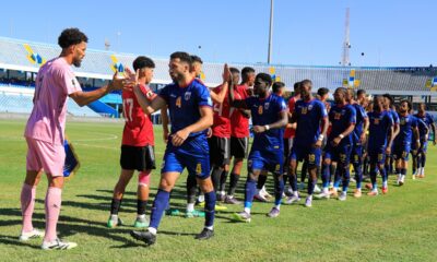 Cape Verde, right, players greet Libyan players before their World Cup 2026 African qualifier Group D soccer match in Tripoli, Libya, Wednesday, Oct. 8, 2025. (AP Photo/Yousef Murad)