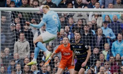 Manchester City's Erling Haaland scores his side's opening goal during the Premier League soccer match between Manchester City and Everton in Manchester, England, Saturday, Oct. 18, 2025. (AP Photo/Dave Thompson)