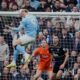Manchester City's Erling Haaland scores his side's opening goal during the Premier League soccer match between Manchester City and Everton in Manchester, England, Saturday, Oct. 18, 2025. (AP Photo/Dave Thompson)