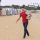 FILE - Serbia's Novak Djokovic carries the Norman Brookes Challenge Cup along Brighton Beach after defeating Russia's Daniil Medvedev on Sunday Feb. 21, 2021 in the men's singles final at the Australian Open tennis championship in Melbourne, Australia, Monday, Feb. 22, 2021.(AP Photo/Hamish Blair,File)