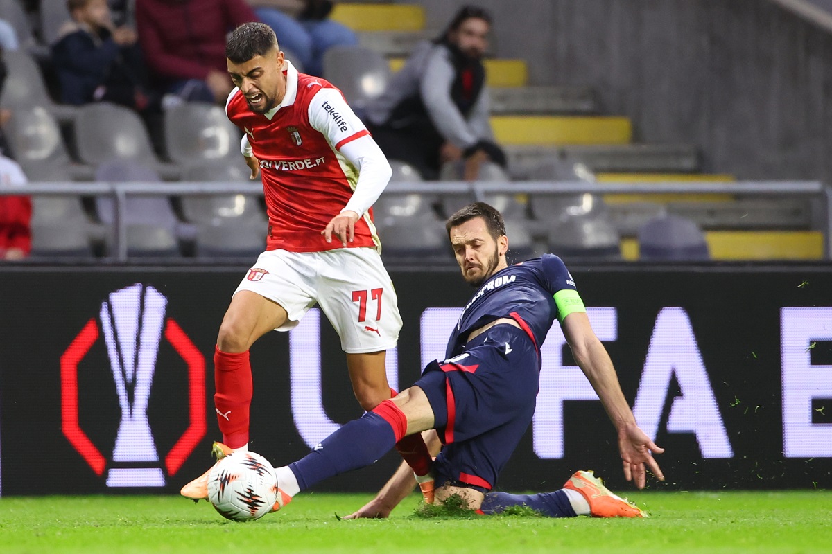 Red Star's Mirko Ivanic fouls Braga's Gabri Martinez to be shown an yellow card during the Europa League opening phase soccer match between SC Braga and Red Star Belgrade in Braga, Portugal, Thursday, Oct. 23, 2025. (AP Photo/Luis Vieira)