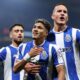 Porto's William Gomes, center, celebrates after scoring the opening goal from the penalty spot during the Europa League opening phase soccer match between FC Porto and Red Star Belgrade at the Dragao stadium in Porto, Portugal, Thursday, Oct. 2, 2025. (AP Photo/Luis Vieira)
