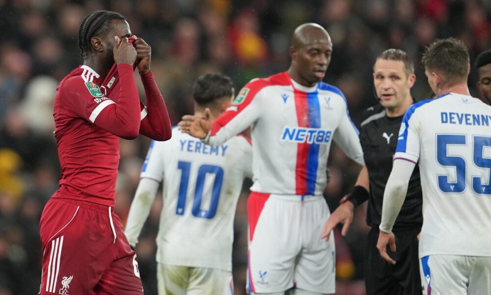 Liverpool's Amara Nallo reacts after shown a red card during the English League Cup fourth round soccer match between Liverpool and Crystal Palace in Liverpool, England, Wednesday, Oct. 29, 2025. (AP Photo/Jon Super)
