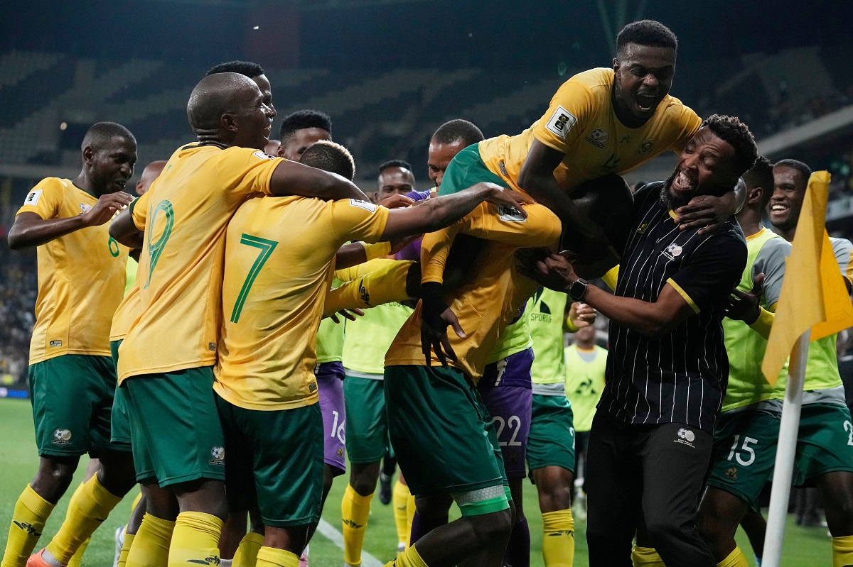 South Africa players celebrate their side's third goal during a World Cup 2026 group C qualifying soccer match between South Africa and Rwanda at Mbombela Stadium, in Nelspruit, South Africa, Tuesday, Oct. 14, 2025. (AP Photo/Themba Hadebe)