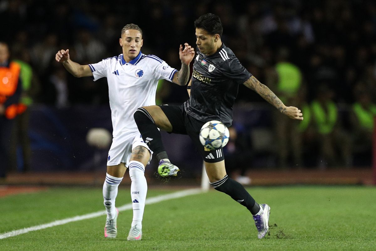 FC Copenhagen's Robert, left, and Qarabag's Matheus Silva fight for the ball during the Champions League opening phase soccer match between Qarabag and FC Copenhagen at the Tofiq Bahramov stadium in Baku, Azerbaijan, Wednesday, Oct. 1, 2025. (AP Photo)