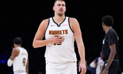 Denver Nuggets center Nikola Jokic walks across the court during the first half of an NBA basketball game against the Minnesota Timberwolves, Monday, Oct. 27, 2025, in Minneapolis. (AP Photo/Abbie Parr)