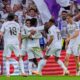 Real Madrid's Jude Bellingham, left, celebrates with teammates after scoring their side's second goal during the Spanish La Liga soccer match between Real Madrid and Barcelona, in Madrid, Sunday, Oct. 26, 2025. (AP Photo/Manu Fernandez)