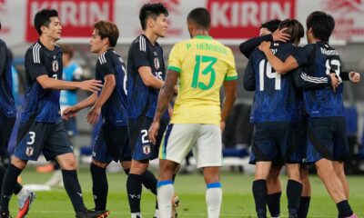 Japan players celebrate after a goal during the friendly soccer match between Japan and Brazil Tuesday, Oct. 14, 2025, in Tokyo. (AP Photo/Eugene Hoshiko)