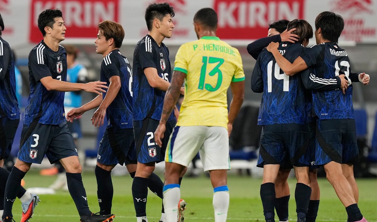 Japan players celebrate after a goal during the friendly soccer match between Japan and Brazil Tuesday, Oct. 14, 2025, in Tokyo. (AP Photo/Eugene Hoshiko)