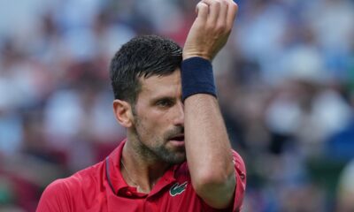 Novak Djokovic of Serbia reacts as he plays with Valentin Vacherot of Monaco during the men's singles semifinal match of the Shanghai Masters tennis tournament at Qizhong Forest Sports City Tennis Center, in Shanghai, China, Saturday, Oct. 11, 2025. (AP Photo/Andy Wong)