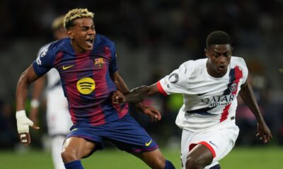 SG's Nuno Mendes fouls Barcelona's Lamine Yamal during the Champions League opening phase soccer match between Barcelona and Paris Saint-Germain at the Lluis Companys Olympic Stadium in Barcelona, Spain, Wednesday, Oct.1, 2025. (AP Photo/Emilio Morenatti)