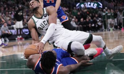 Milwaukee Bucks' Giannis Antetokounmpo is fouled by New York Knicks' OG Anunoby during the second half of an NBA basketball game Tuesday, Oct. 28, 2025, in Milwaukee. (AP Photo/Morry Gash)