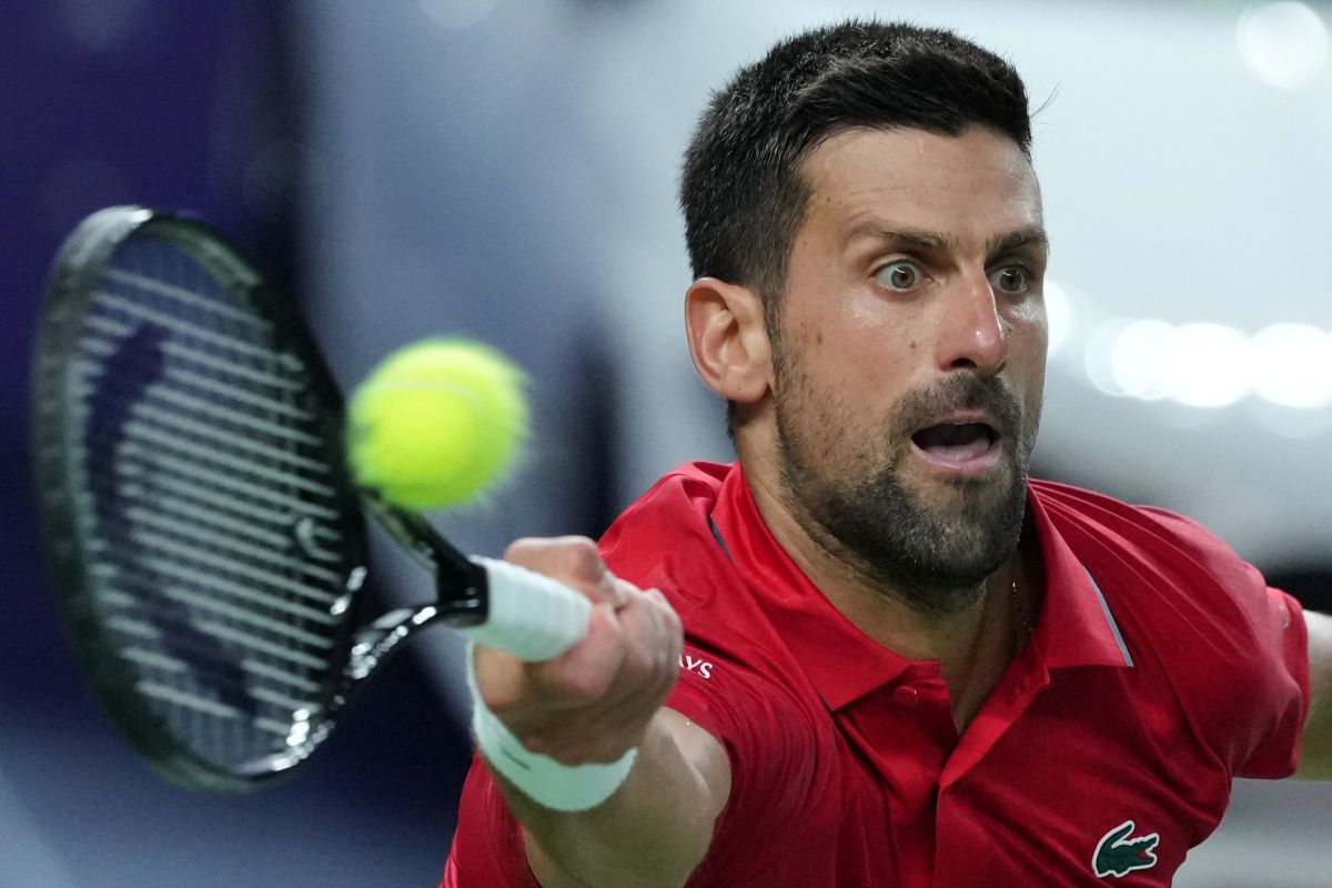 Novak Djokovic of Serbia returns a backhand shot from Zizou Bergs of Belgium during the men's singles quarterfinal match of the Shanghai Masters tennis tournament at Qizhong Forest Sports City Tennis Center, in Shanghai, China, Thursday, Oct. 9, 2025. (AP Photo/Andy Wong)