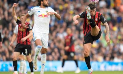 Bournemouth's Marcos Senesi, right, and Leeds United's Dominic Calvert-Lewin vie for the ball, during the English Premier League soccer match between Leeds United and Bournemouth, at Elland Road, in Leeds, England, Saturday, Sept. 27, 2025. (Danny Lawson/PA via AP)