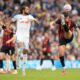 Bournemouth's Marcos Senesi, right, and Leeds United's Dominic Calvert-Lewin vie for the ball, during the English Premier League soccer match between Leeds United and Bournemouth, at Elland Road, in Leeds, England, Saturday, Sept. 27, 2025. (Danny Lawson/PA via AP)