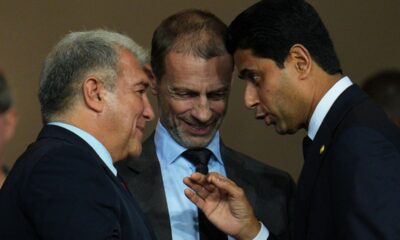 UEFA President Aleksander Ceferin, center, FC Barcelona president Joan Laporta, left, and PSG president Nasser Al-Khelaifi speak before the Champions League opening phase soccer match between Barcelona and Paris Saint-Germain at the Lluis Companys Olympic Stadium in Barcelona, Spain, Wednesday, Oct.1, 2025. (AP Photo/Emilio Morenatti)