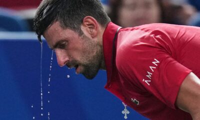 Novak Djokovic of Serbia cools himself with water during the men's singles semifinal match with Valentin Vacherot of Monaco, at the Shanghai Masters tennis tournament at Qizhong Forest Sports City Tennis Center, in Shanghai, China, Saturday, Oct. 11, 2025. (AP Photo/Andy Wong)