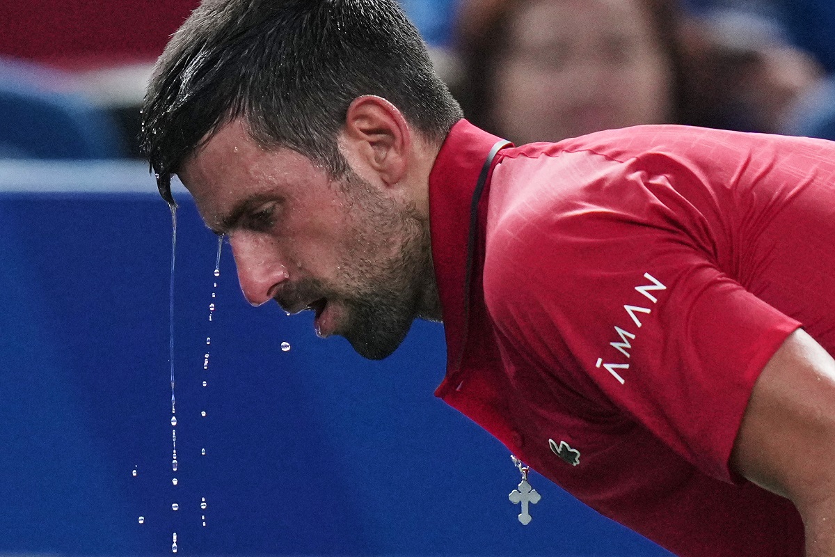 Novak Djokovic of Serbia cools himself with water during the men's singles semifinal match with Valentin Vacherot of Monaco, at the Shanghai Masters tennis tournament at Qizhong Forest Sports City Tennis Center, in Shanghai, China, Saturday, Oct. 11, 2025. (AP Photo/Andy Wong)