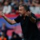 Barcelona's head coach Hansi Flick reacts during a La Liga soccer match between Barcelona and Girona in Barcelona, Spain, Saturday, Oct. 18, 2025. AP Photo/Joan Monfort)