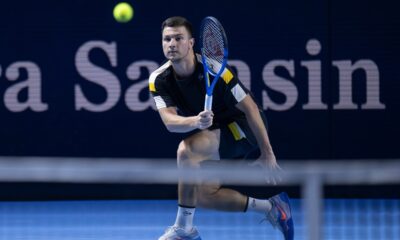 Serbia's Miomir Kecmanovic returns a ball to Switzerland's Stan Wawrinka during their first round match at the Swiss Indoors tennis tournament at the St. Jakobshalle in Basel, Switzerland, Tuesday, Oct. 21, 2025. (Georgios Kefalas/Keystone via AP)