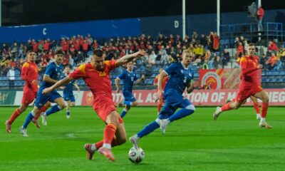 Montenegro's Milutin Osmajic, front, kicks the ball during an international friendly soccer match between Montenegro and Liechtenstein at the City Stadium, in Podgorica, Montenegro, Monday, Oct. 13, 2025. (AP Photo/Risto Bozovic)