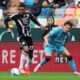 Udinese's Christian Kabasele, left, controls the ball from Cagliari's Gennaro Borrelli during a Serie A soccer match between Udinese and Cagliari at the Bluenergy Stadium in Udine, north eastern Italy, Sunday, Oct. 5, 2025. (Andrea Bressanutti/LaPresse via AP)
