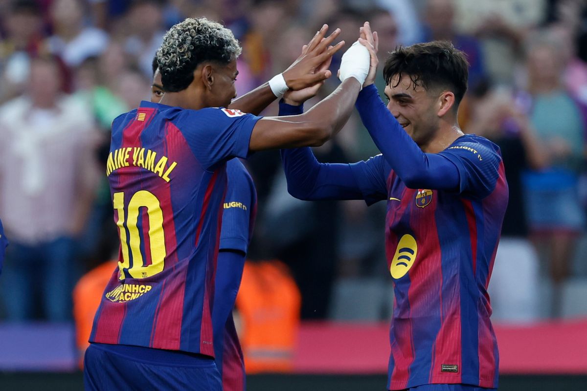 Barcelona's Lamine Yamal and Pedri acelebrate fter a goal during a La Liga soccer match between Barcelona and Girona in Barcelona, Spain, Saturday, Oct. 18, 2025. AP Photo/Joan Monfort)