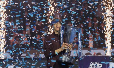 Italy's Jannik Sinner holds the trophy after winning the final tennis match of the ATP World Tour Finals against Spain's Carlos Alcaraz in Turin, Italy, Sunday, Nov. 16, 2025. (AP Photo/Antonio Calanni)