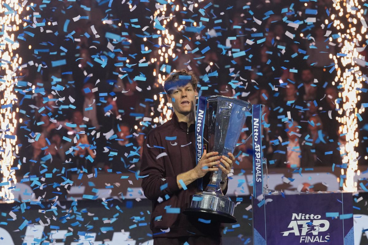 Italy's Jannik Sinner holds the trophy after winning the final tennis match of the ATP World Tour Finals against Spain's Carlos Alcaraz in Turin, Italy, Sunday, Nov. 16, 2025. (AP Photo/Antonio Calanni)