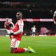 Arsenal's Eberechi Eze celebrates after scoring during a Premier League soccer match between Arsenal and Tottenham in London, Sunday, Nov. 23, 2025. (AP Photo/Frank Augstein)