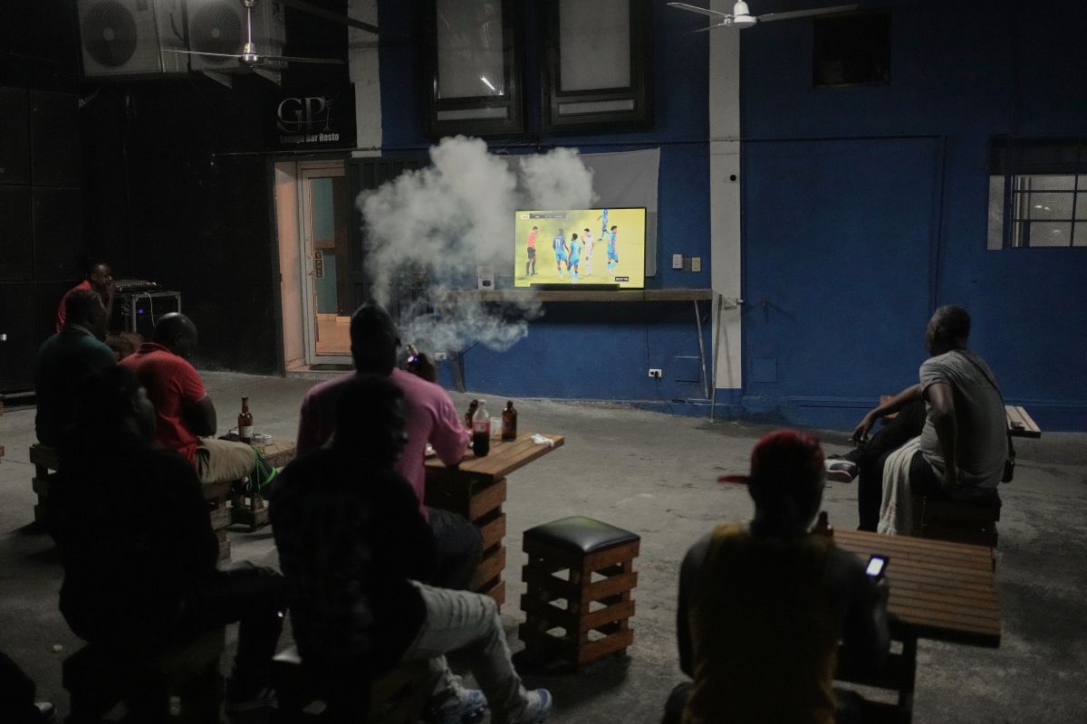 Fans watch a 2026 FIFA World Cup qualifying match between Haiti and Nicaragua, in Port-au-Prince, Haiti, Tuesday, Nov. 18, 2025. (AP Photo/Odelyn Joseph)