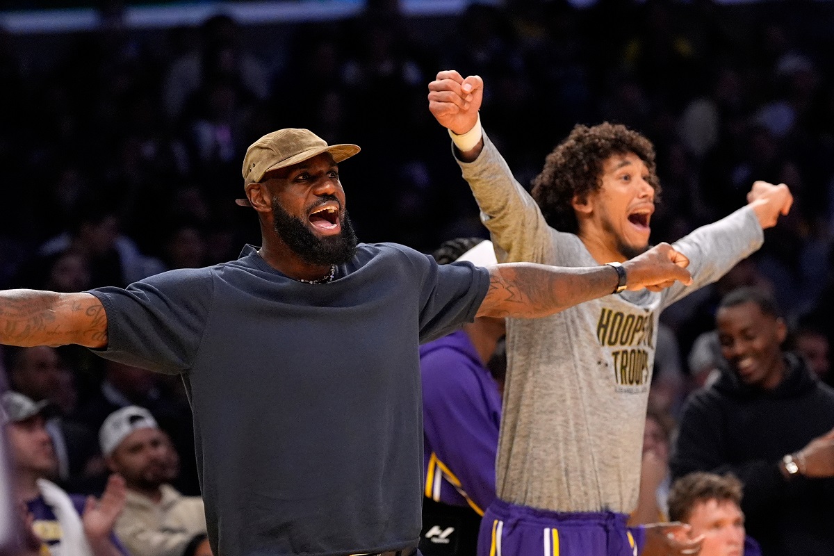 Los Angeles Lakers' LeBron James, left, and Jaxson Hayes gesture during the second half of an NBA basketball game against the San Antonio Spurs, Wednesday, Nov. 5, 2025, in Los Angeles. (AP Photo/Mark J. Terrill)