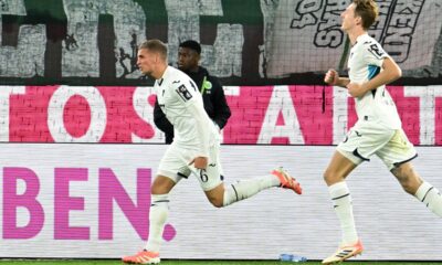 Hoffenheim's Grischa Prömel, left, celebrates scoring during the Bundesliga soccer match between VfL Wolfsburg - TSG Hoffenheim in Wolfsburg, Germany, Sunday Nov. 2, 2025. (Swen Pförtner/dpa via AP)